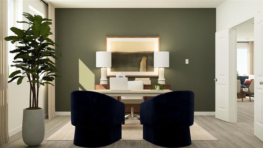 Home office featuring light wood-style flooring and baseboards