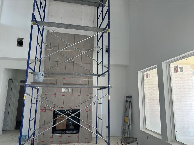 Family Room with soaring ceiling and fireplace