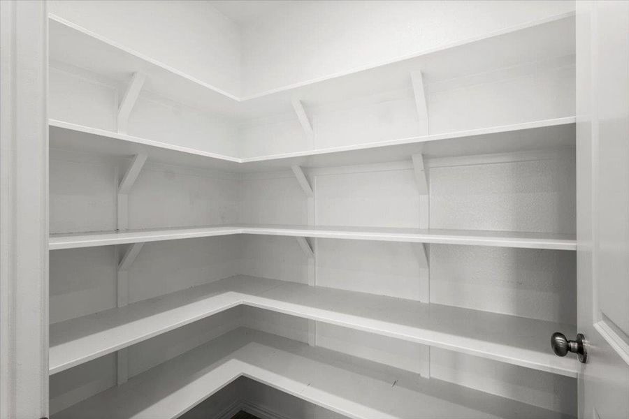 Ample shelving in this well-organized pantry offers generous storage. Ample shelving in this well-organized pantry offers generous storage.