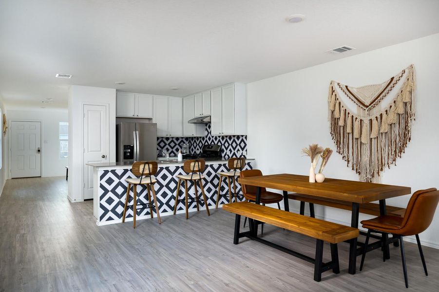 Dining area with light wood finished floors and baseboards Dining area with light wood finished floors and baseboards