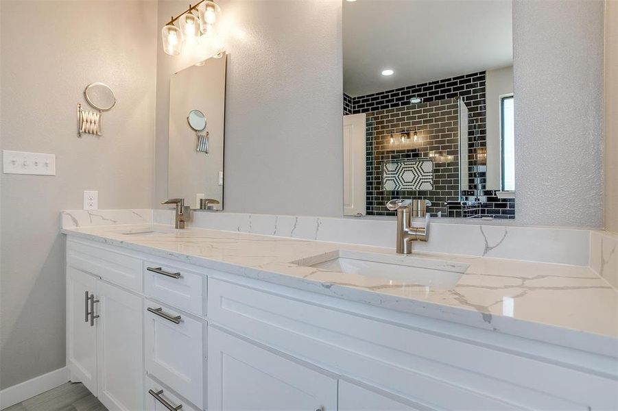 Bathroom with vanity and a shower