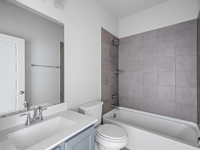 Full bath with bathing tub / shower combination and vanity Full bath with bathing tub / shower combination and vanity