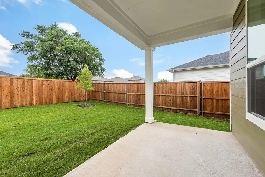Exterior details and patio area of a home in Creekside of Crowley, Crowley (Image 3).