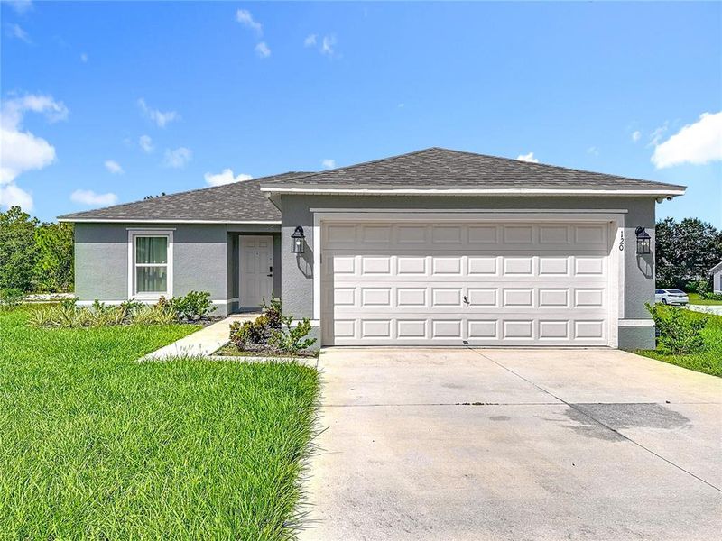 Front exterior of a new home in , Kissimmee, FL, highlighting curb appeal (Image 23). Front exterior of a new home in , Kissimmee, FL, highlighting curb appeal (Image 23).