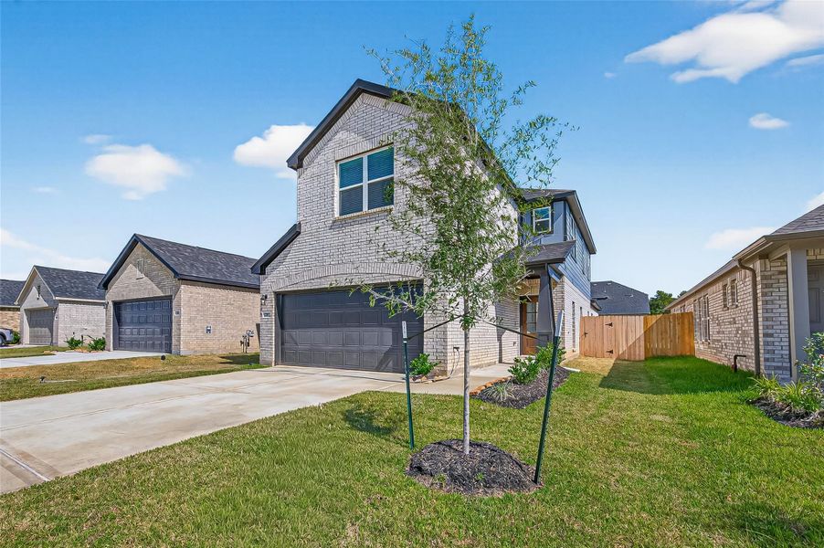 Front exterior of a new home in Mill Creek Trails, Magnolia, TX, highlighting curb appeal (Image 25). Front exterior of a new home in Mill Creek Trails, Magnolia, TX, highlighting curb appeal (Image 25).