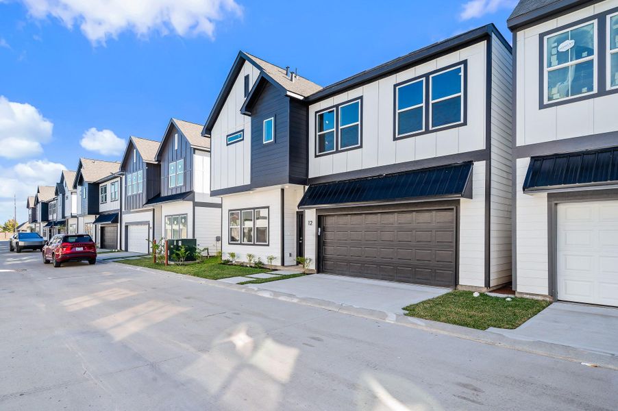 Front exterior of a new home in Metro Village, Houston, TX, highlighting curb appeal (Image 25). Front exterior of a new home in Metro Village, Houston, TX, highlighting curb appeal (Image 25).