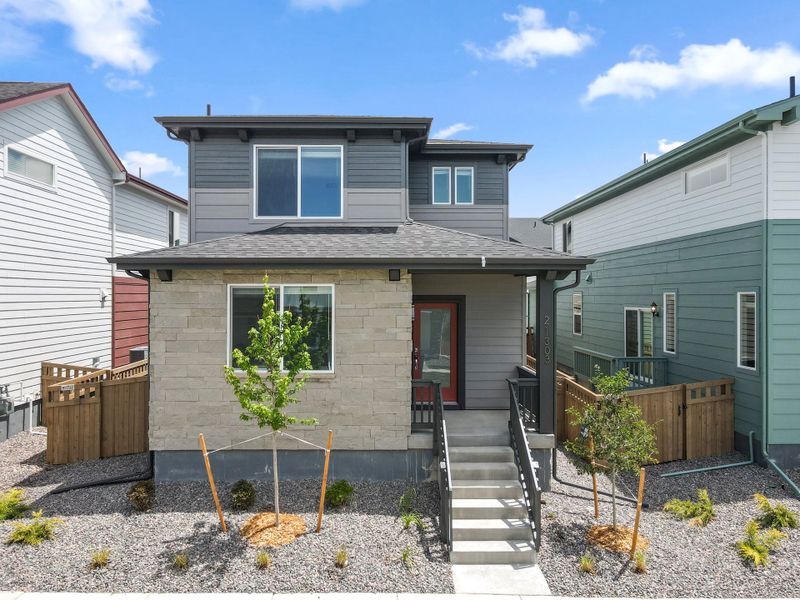 Exterior details and patio area of a home in Woodrose at Painted Prairie, Aurora (Image 3).