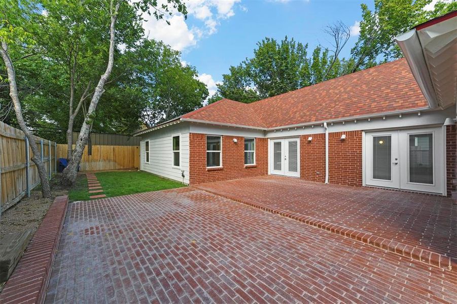 Rear view of property with french doors and a patio area