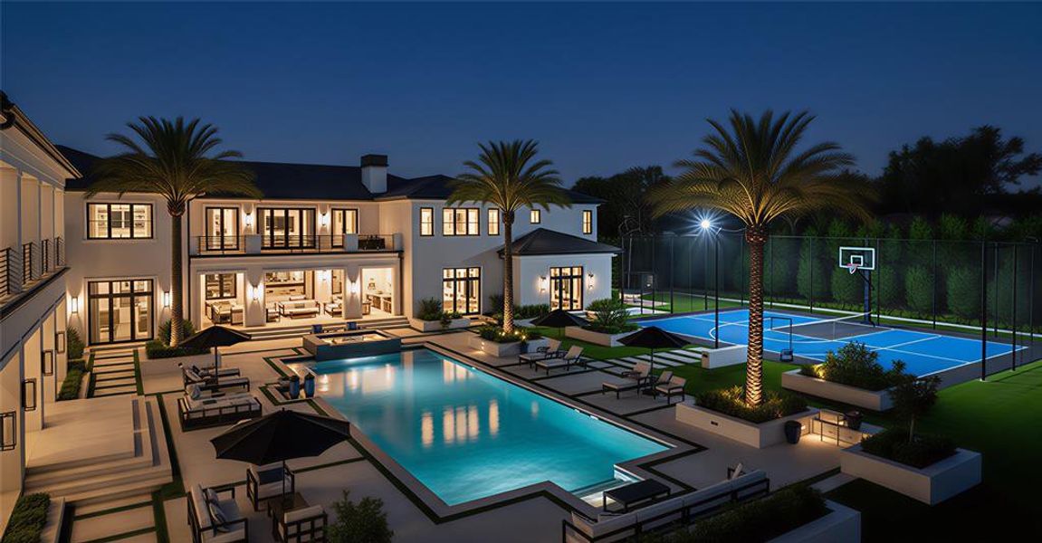 Pool at night with a balcony, a patio area, a pool with connected hot tub, and french doors