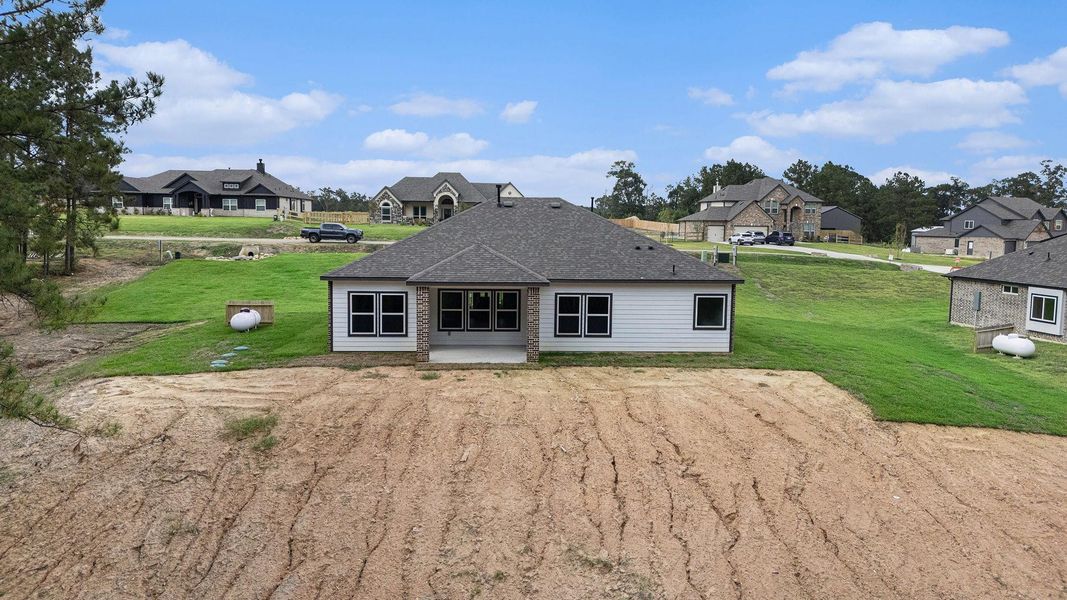 Exterior details and patio area of a home in Rose Hill Estates, Willis (Image 26).