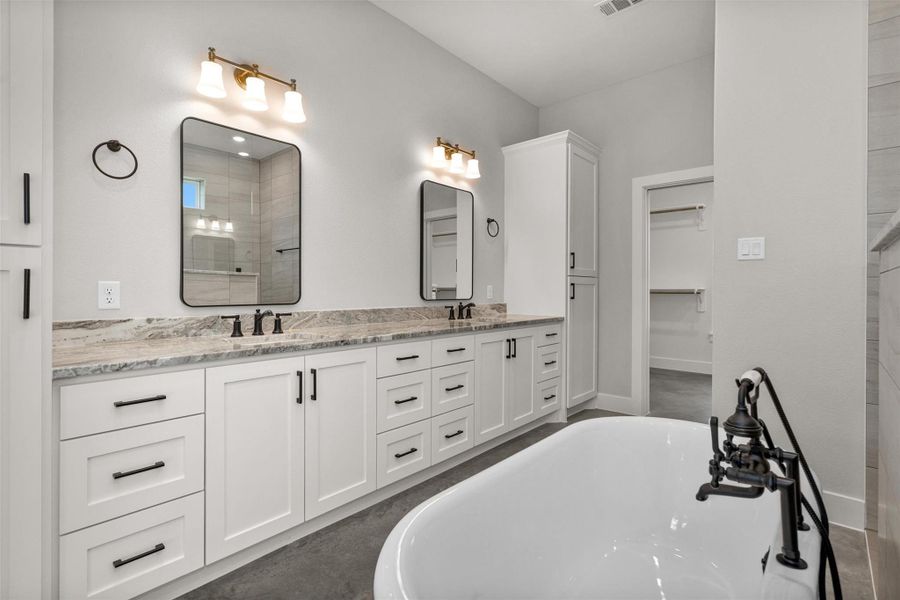 This well-appointed primary bath delivers the perfect blend of elegance, space, and everyday practicality.