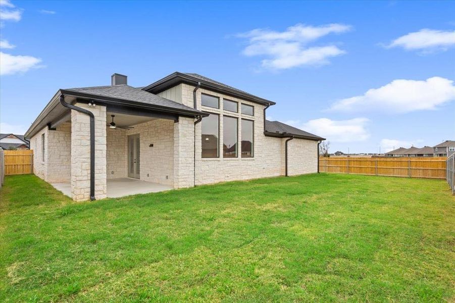 Exterior details and patio area of a home in , Hewitt (Image 26).