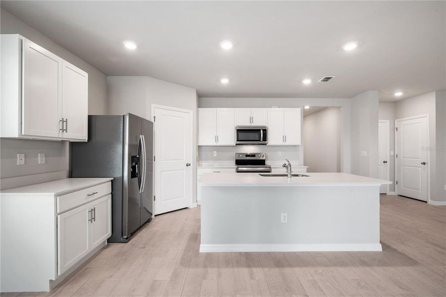 Furnished interior view inside a new home in Coral Lakes - Tradition & Express, Punta Gorda (Image 7). Furnished interior view inside a new home in Coral Lakes - Tradition & Express, Punta Gorda (Image 7).