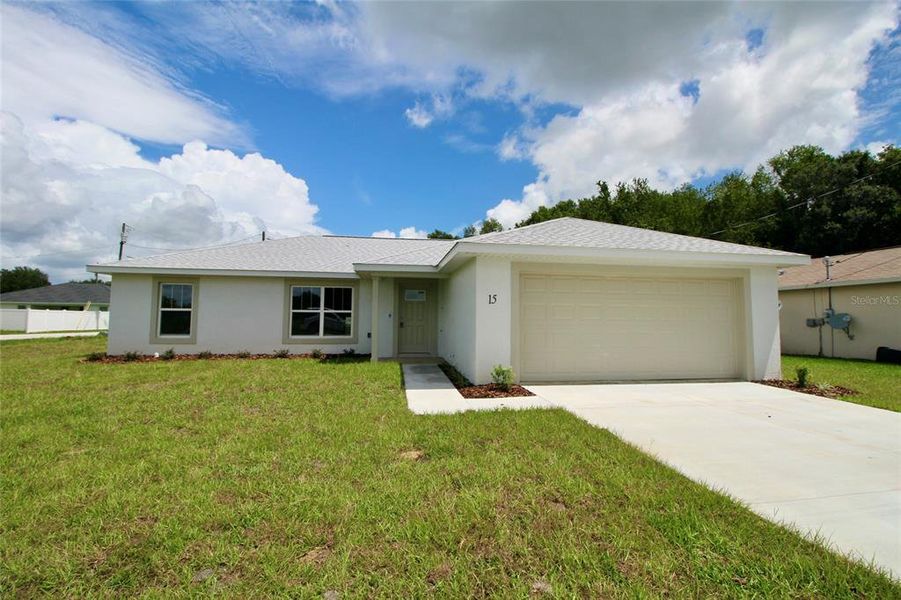 Front exterior of a new home in , Ocala, FL, highlighting curb appeal (Image 9).