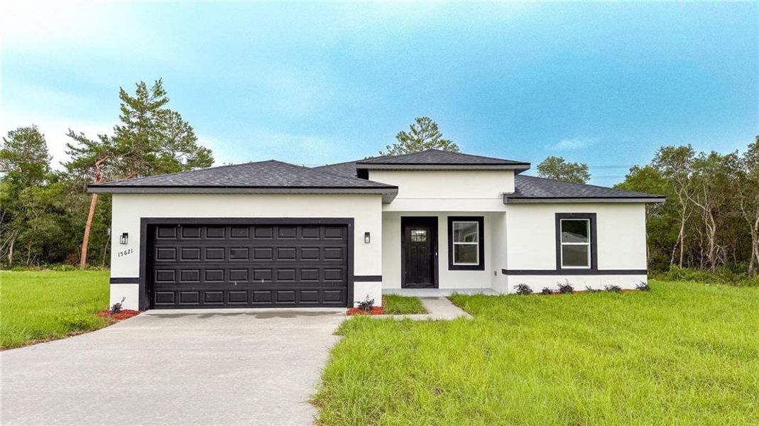 Front exterior of a new home in , Ocala, FL, highlighting curb appeal (Image 1). Front exterior of a new home in , Ocala, FL, highlighting curb appeal (Image 1).