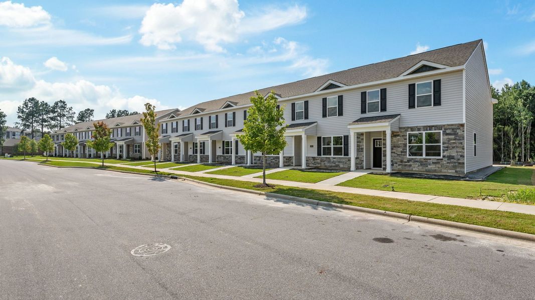 Front exterior of a new home in Clock Road Townhomes, New Bern, NC, highlighting curb appeal (Image 20).