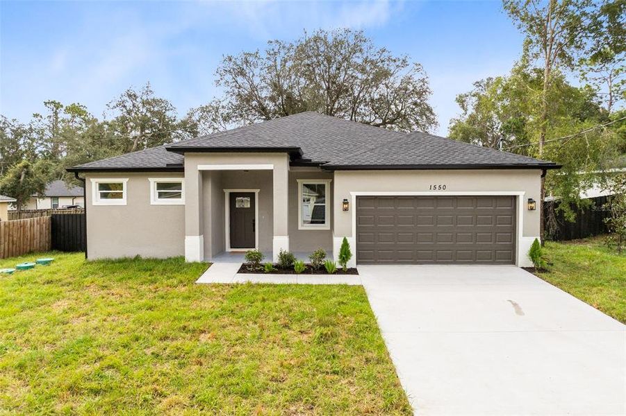 Front exterior of a new home in , Orange City, FL, highlighting curb appeal (Image 15).