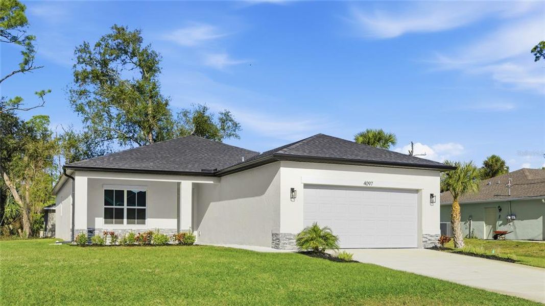 Front exterior of a new home in , North Port, FL, highlighting curb appeal (Image 20).