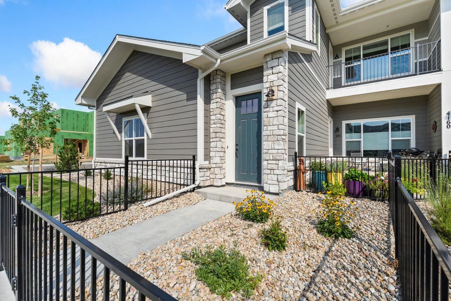 Front exterior of a new home in The Lakes at Centerra - Discovery, Loveland, CO, highlighting curb appeal (Image 2).