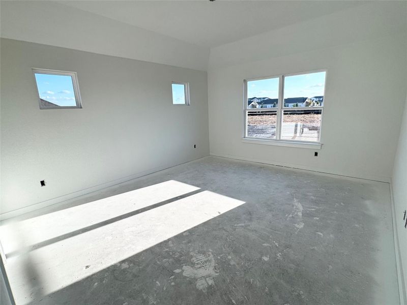 Spare room featuring concrete floors