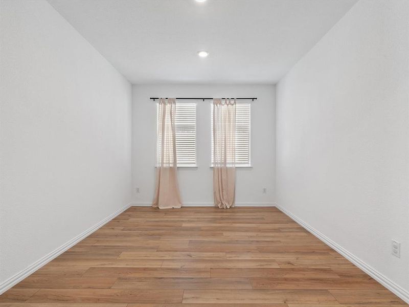 Spare room featuring light hardwood / wood-style flooring