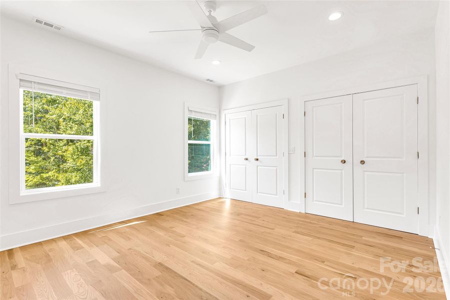 Bedroom ensuite off hallway with separate closets