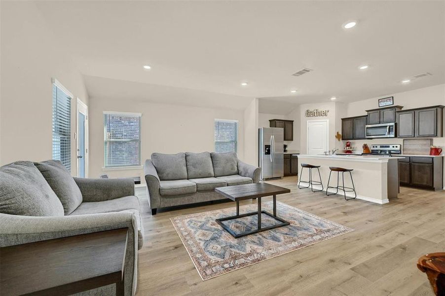 Living room featuring light hardwood / wood-style floors and sink