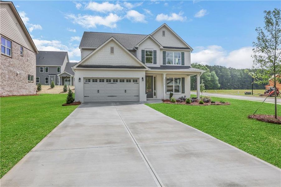 Front exterior of a new home in , Loganville, GA, highlighting curb appeal (Image 23).