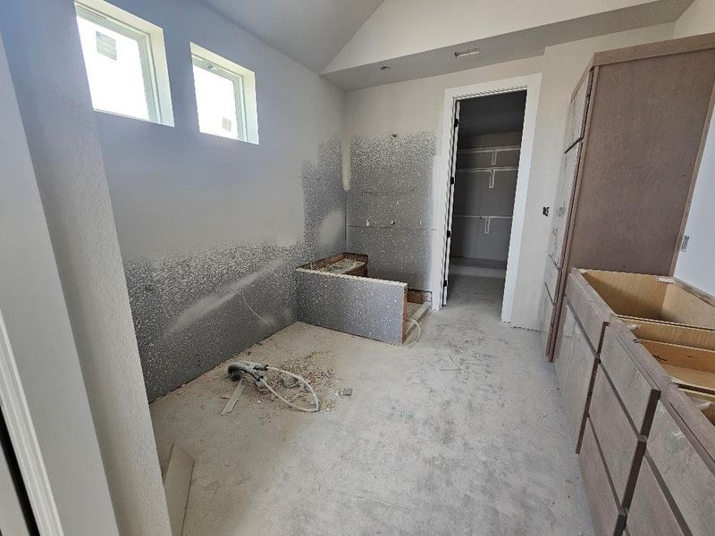 Bathroom featuring vaulted ceiling Bathroom featuring vaulted ceiling