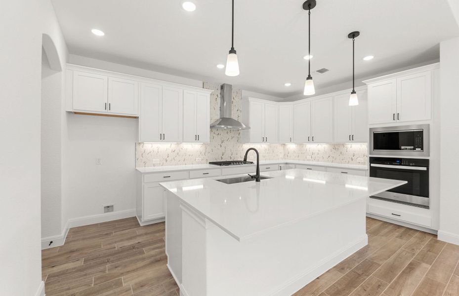 Furnished interior view inside a new home in West Cypress Hills, Spicewood (Image 11).