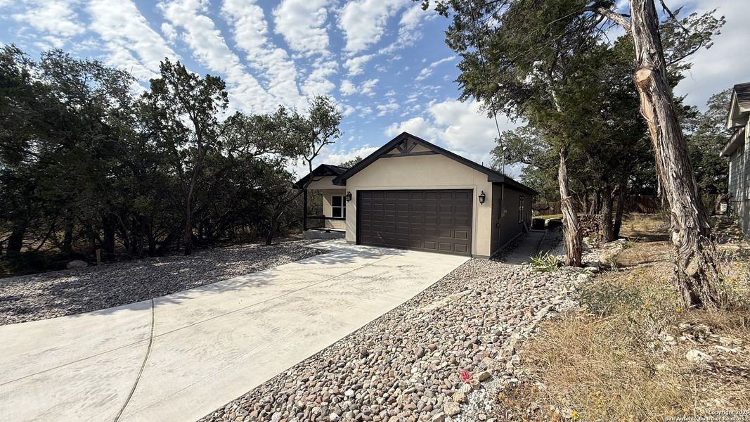 Exterior details and patio area of a home in , Spring Branch (Image 4). Exterior details and patio area of a home in , Spring Branch (Image 4).