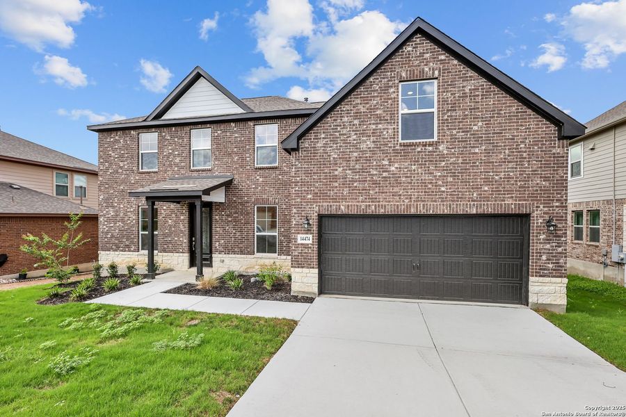 Front exterior of a new home in Ladera, San Antonio, TX, highlighting curb appeal (Image 6).