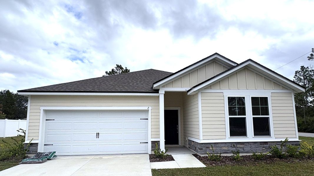 Front exterior of a new home in Palm Coast, Palm Coast, FL, highlighting curb appeal (Image 1). Front exterior of a new home in Palm Coast, Palm Coast, FL, highlighting curb appeal (Image 1).