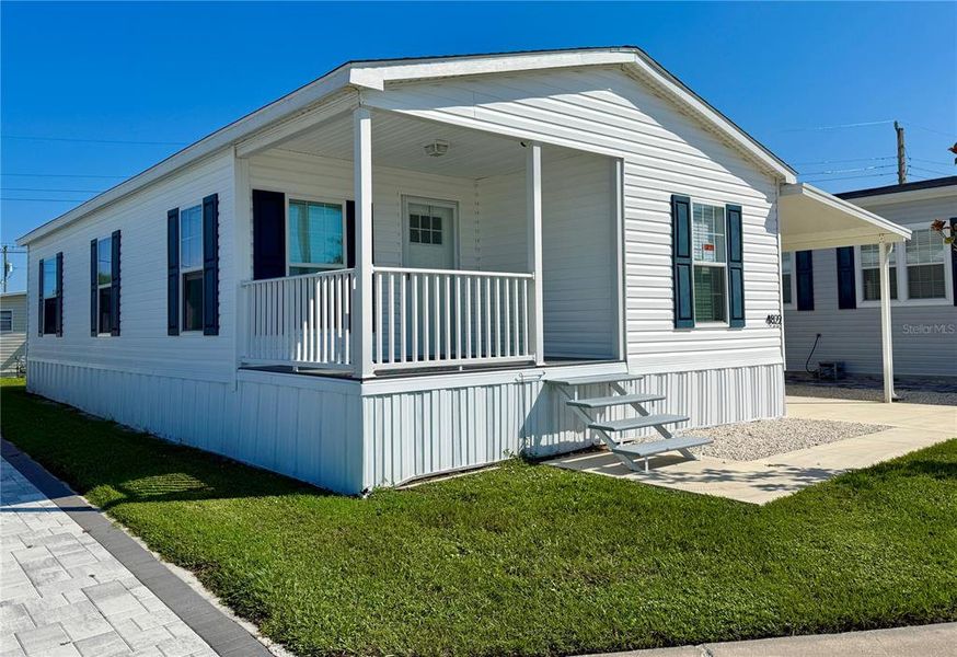 Front exterior of a new home in , Sarasota, FL, highlighting curb appeal (Image 18).