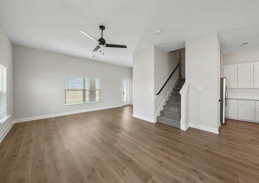 The open concept layout connects the kitchen, family room and dining area.