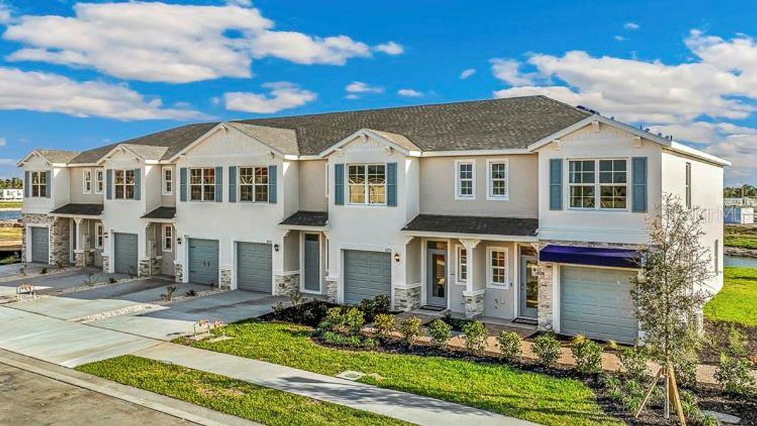 Front exterior of a new home in Ashcombe Wellen Park, Venice, FL, highlighting curb appeal (Image 1). Front exterior of a new home in Ashcombe Wellen Park, Venice, FL, highlighting curb appeal (Image 1).