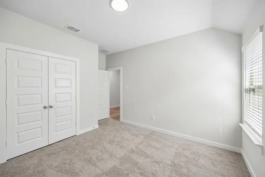 Bedroom in the Oscar home plan by Trophy Signature Homes – REPRESENTATIVE PHOTO Bedroom in the Oscar home plan by Trophy Signature Homes – REPRESENTATIVE PHOTO