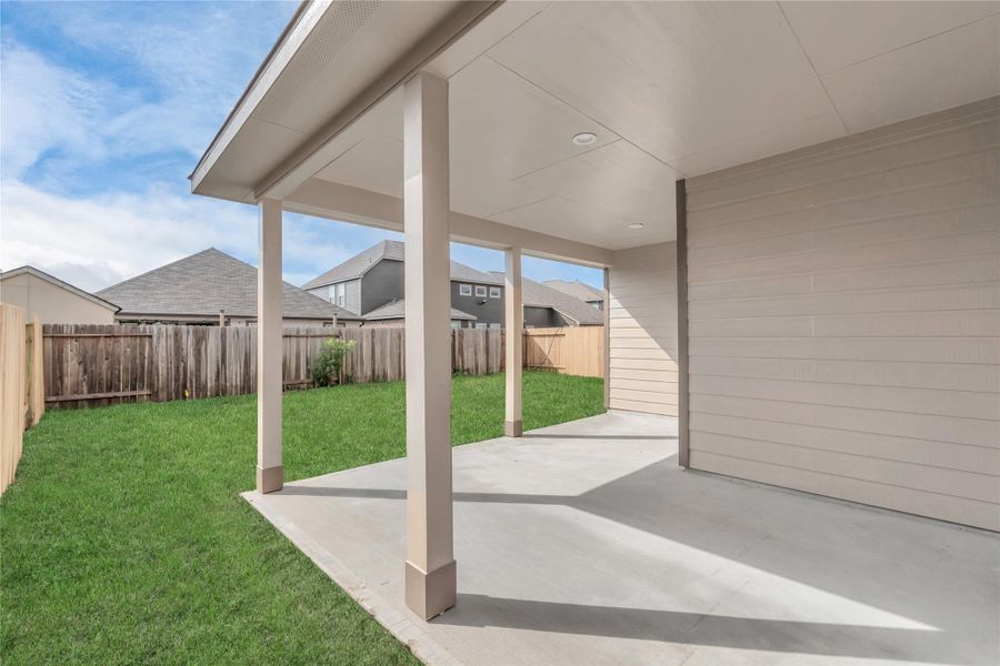 Step into a world of outdoor possibilities with this remarkable backyard and its charming covered patio. Sample photo of completed home with similar floor plan. As-built interior colors and selections may vary.