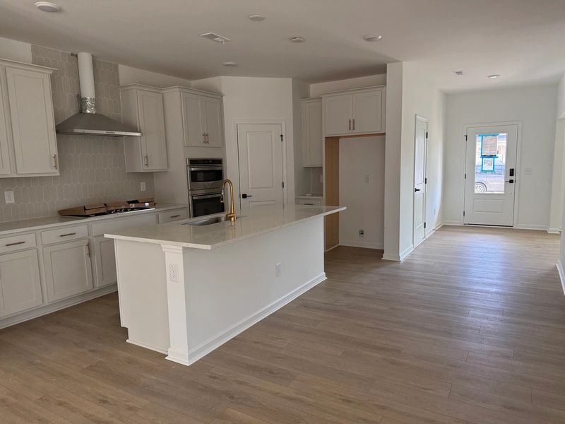 Kitchen featuring the AW Collection® Serene - Clean lines and earthy textures define the space. Kitchen featuring the AW Collection® Serene - Clean lines and earthy textures define the space.