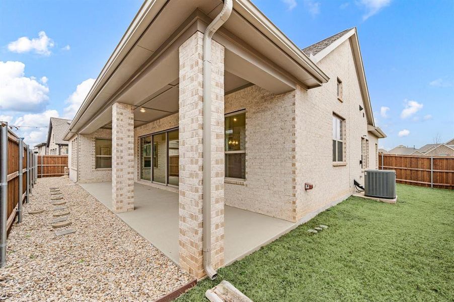 Exterior details and patio area of a home in Elements at Viridian - Garden Series, Arlington (Image 23).