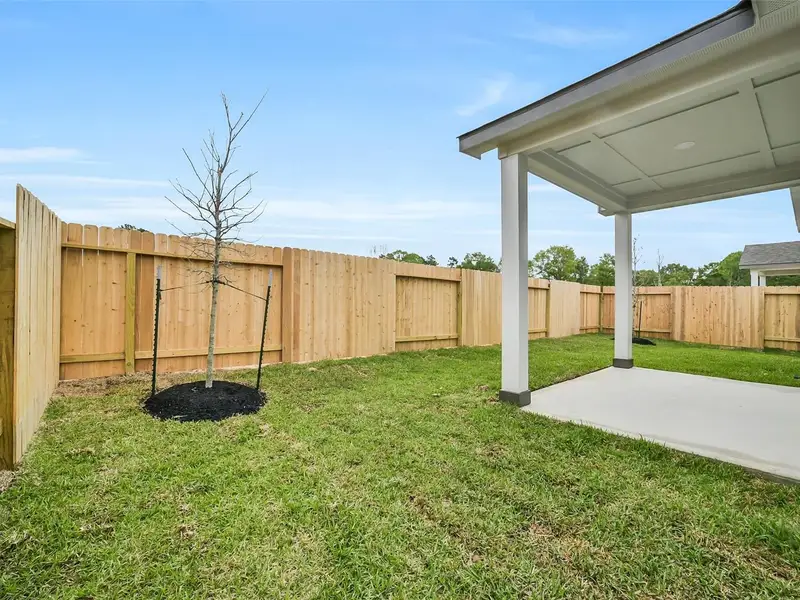 Exterior details and patio area of a home in Caney Creek Place, Conroe (Image 4).
