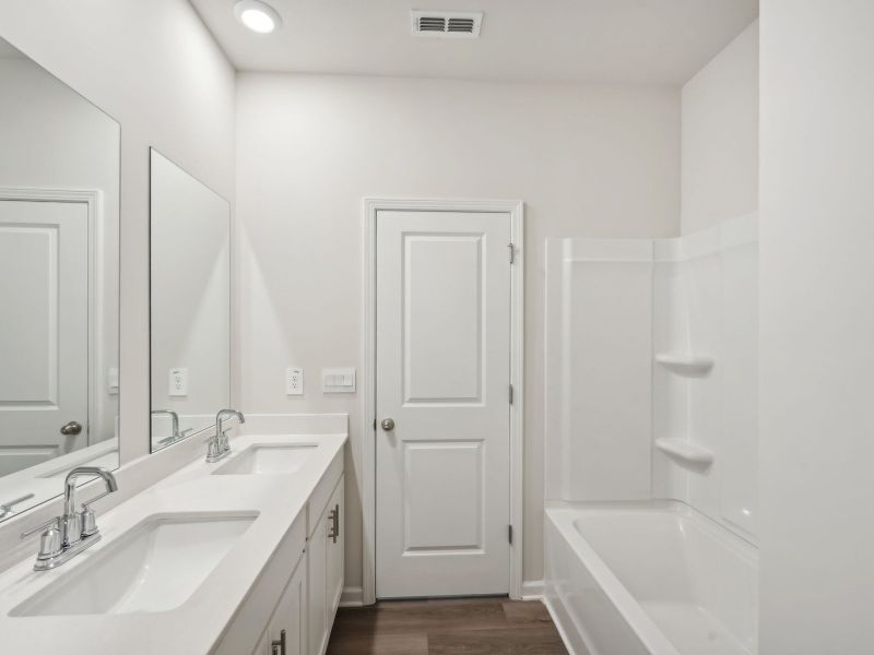 Furnished interior view inside a new home in Martin Springs - Estate Series, Lawrenceville (Image 13).