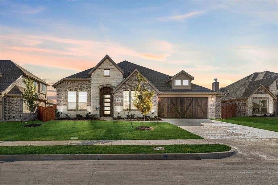 Front exterior of a new home in Villages of Walnut Grove, Midlothian, TX, highlighting curb appeal (Image 2).