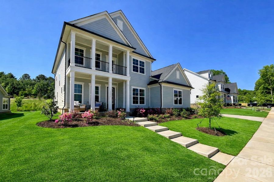 Front exterior of a new home in , Huntersville, NC, highlighting curb appeal (Image 21). Front exterior of a new home in , Huntersville, NC, highlighting curb appeal (Image 21).