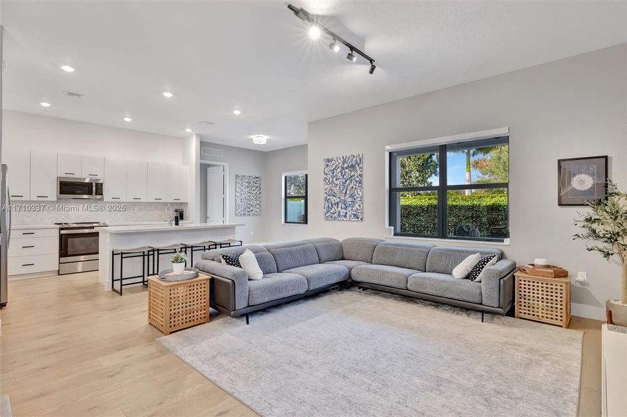 Open concept great room / family room, with views toward back yard.