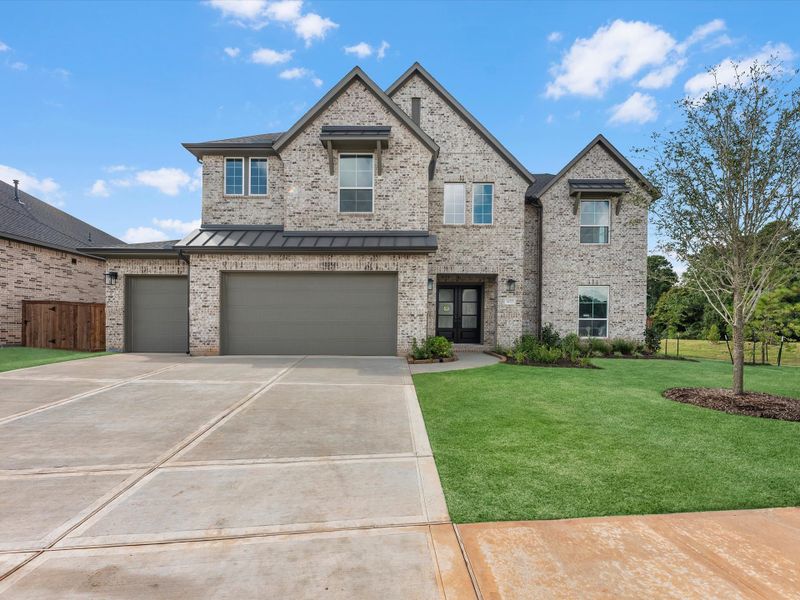 Front exterior of a new home in Clopton Farms, Montgomery, TX, highlighting curb appeal (Image 2). Front exterior of a new home in Clopton Farms, Montgomery, TX, highlighting curb appeal (Image 2).