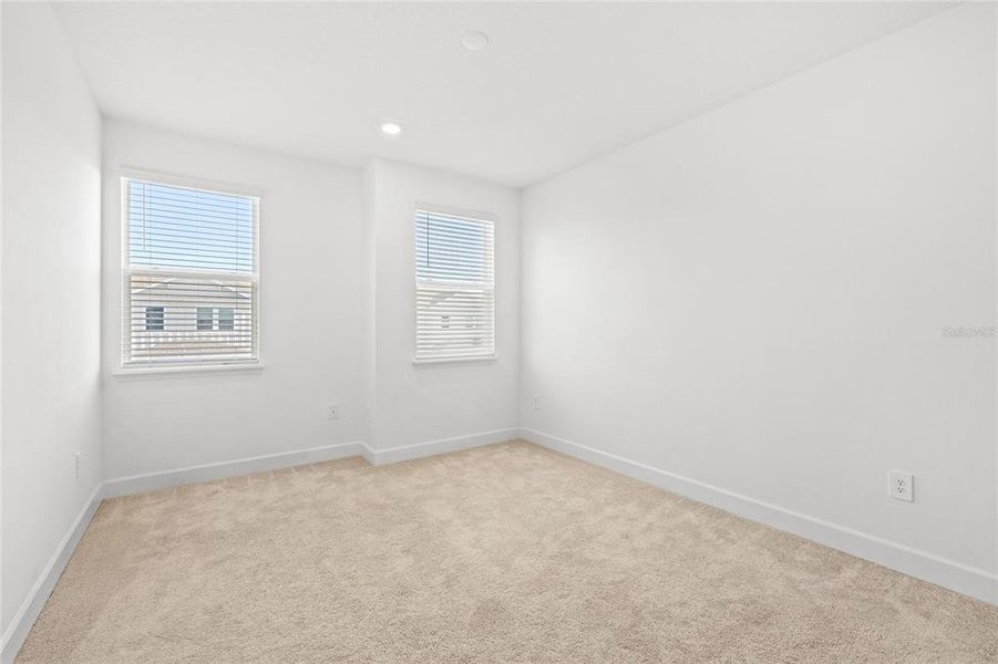 Spacious, unfurnished interior of a new home in Harvest At Ovation 50s, Winter Garden (Image 27).