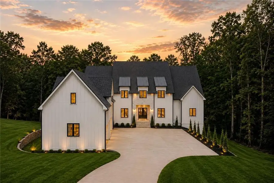 Front exterior of a new home in , Cumming, GA, highlighting curb appeal (Image 1). Front exterior of a new home in , Cumming, GA, highlighting curb appeal (Image 1).