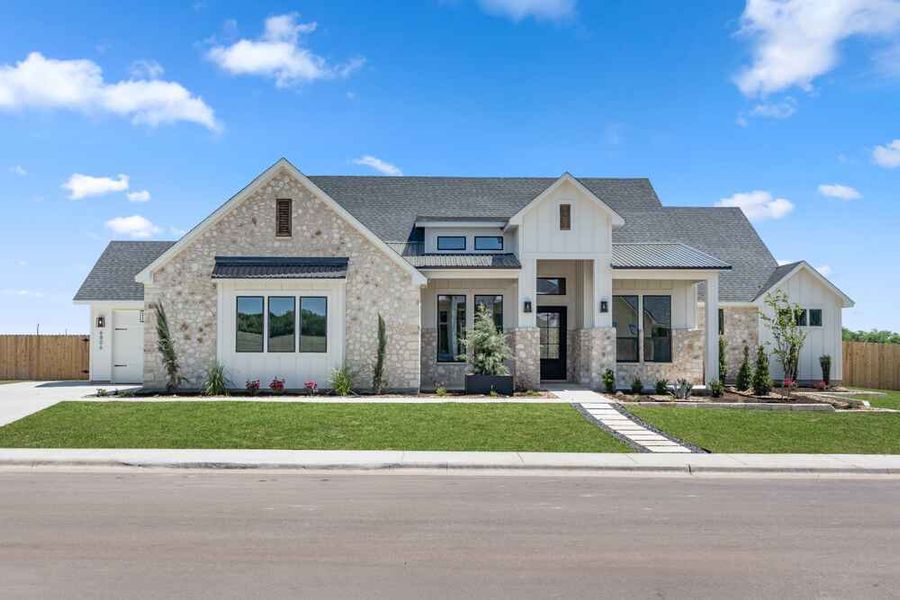 Front exterior of a new home in King Oaks, Salado, TX, highlighting curb appeal (Image 6). Front exterior of a new home in King Oaks, Salado, TX, highlighting curb appeal (Image 6).