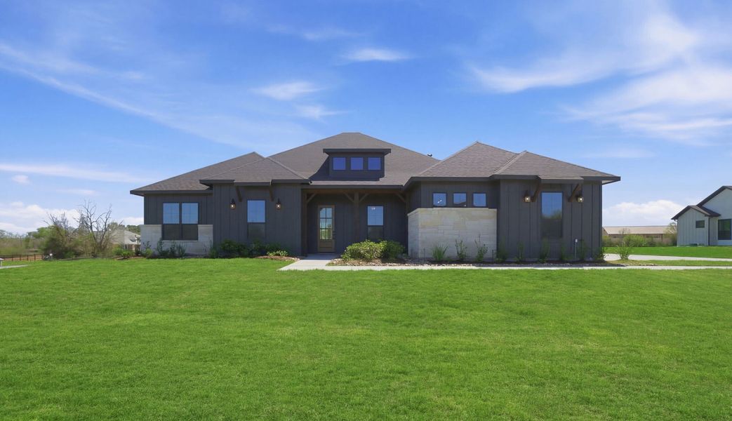 Front exterior of a new home in Chapel Bend, Montgomery, TX, highlighting curb appeal (Image 1). Front exterior of a new home in Chapel Bend, Montgomery, TX, highlighting curb appeal (Image 1).